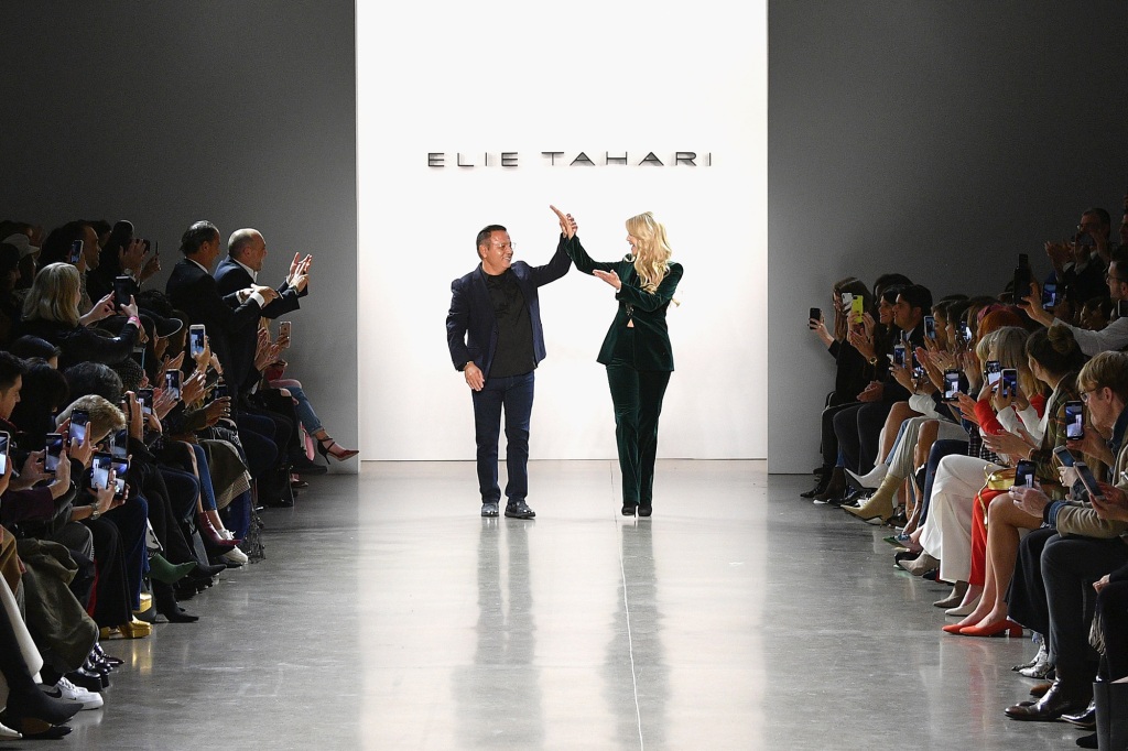 Elie Tahari and Christie Brinkley close out his show in 2019.